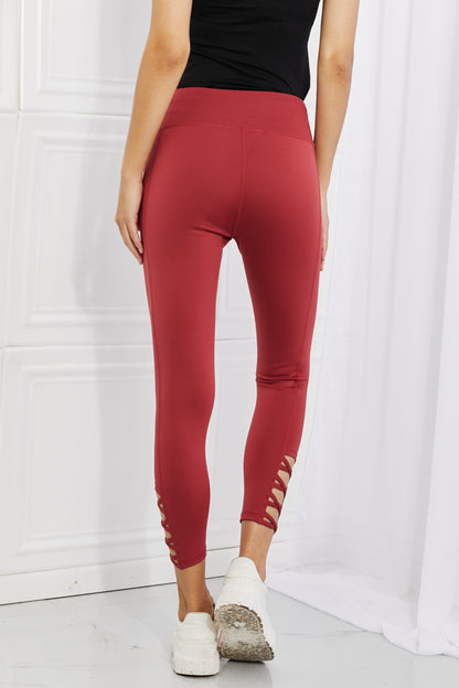 Yelete Ready For Action Full Size Ankle Cutout Active Leggings in Brick Red